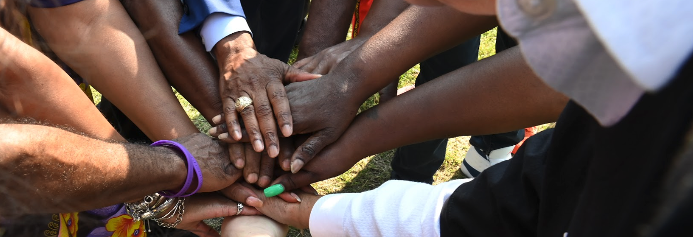 hands joined in a huddle