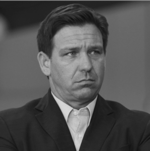 A portrait of DeSantis in black and white, pouting, because he's ALWAYS POUTING